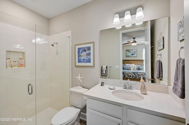 598 Marquesa Cir, Saint Johns, FL 32259 - ensuite bathroom featuring connected bathroom, toilet, a ceiling fan, vanity, and a stall shower