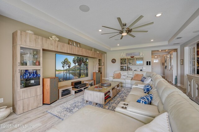 598 Marquesa Cir, Saint Johns, FL 32259 - living area featuring a textured ceiling, light wood-style flooring, ceiling fan, recessed lighting, and a raised ceiling
