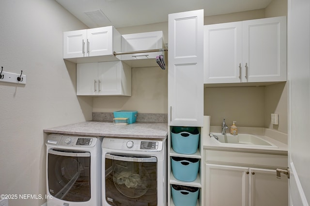 598 Marquesa Cir, Saint Johns, FL 32259 - laundry area with a sink, cabinet space, washer and dryer, and visible vents