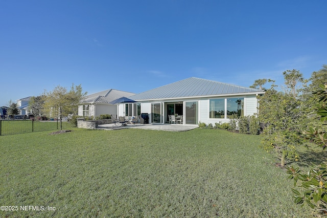 598 Marquesa Cir, Saint Johns, FL 32259 - back of property featuring a patio area, a lawn, metal roof, and fence