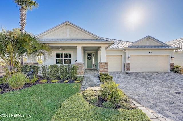 598 Marquesa Cir, Saint Johns, FL 32259 - view of front of house with metal roof, a standing seam roof, and decorative driveway