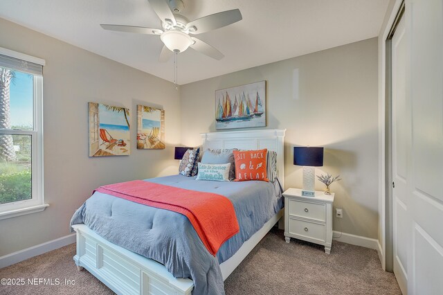 598 Marquesa Cir, Saint Johns, FL 32259 - carpeted bedroom featuring baseboards, ceiling fan, multiple windows, and a closet