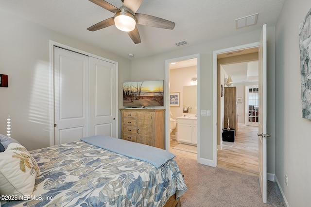 598 Marquesa Cir, Saint Johns, FL 32259 - bedroom with a closet, a ceiling fan, baseboards, light colored carpet, and visible vents
