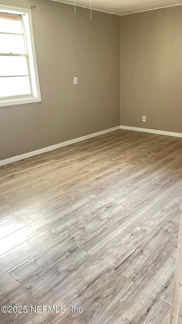 719 Broxton St, Jacksonville, FL 32208 - spare room featuring baseboards and wood finished floors