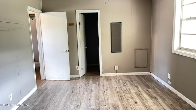 719 Broxton St, Jacksonville, FL 32208 - unfurnished bedroom with baseboards and wood finished floors