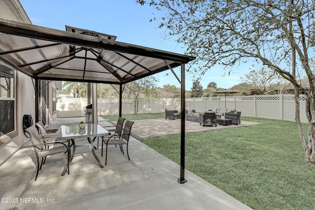 view of patio with outdoor lounge area, a gazebo, outdoor dining area, and a fenced backyard