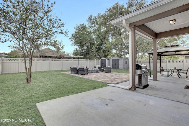 view of yard with a patio area, a shed, a gazebo, an outbuilding, and an outdoor hangout area