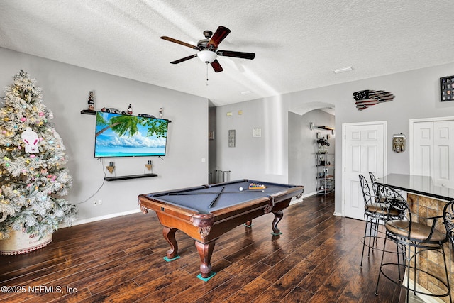 game room featuring a textured ceiling, wood finished floors, pool table, and a ceiling fan