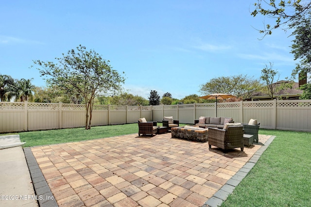view of patio with a fenced backyard and an outdoor living space with a fire pit
