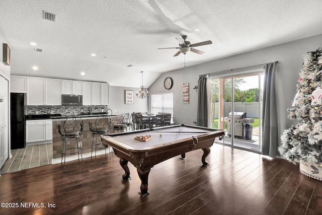 rec room with lofted ceiling, visible vents, billiards, ceiling fan, and wood finished floors