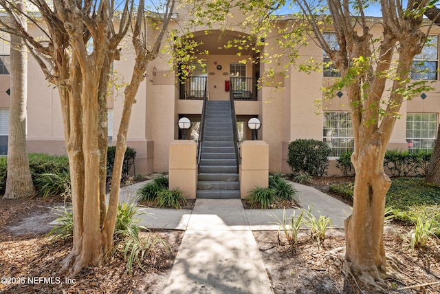 view of property featuring stairway