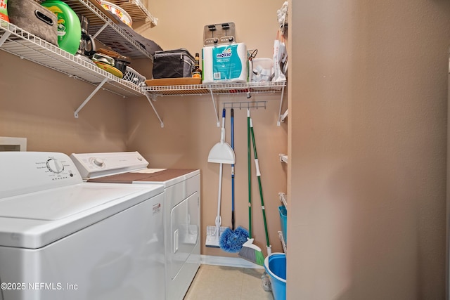 laundry area with light tile patterned flooring, laundry area, and separate washer and dryer