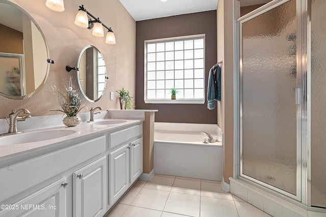 bathroom featuring a sink, tile patterned floors, and a shower stall