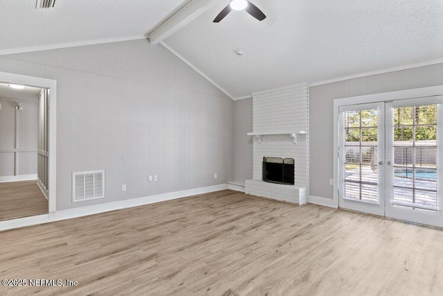 1967 Sussex Dr S, Orange Park, FL 32073 - unfurnished living room with lofted ceiling with beams, visible vents, a ceiling fan, and light wood finished floors