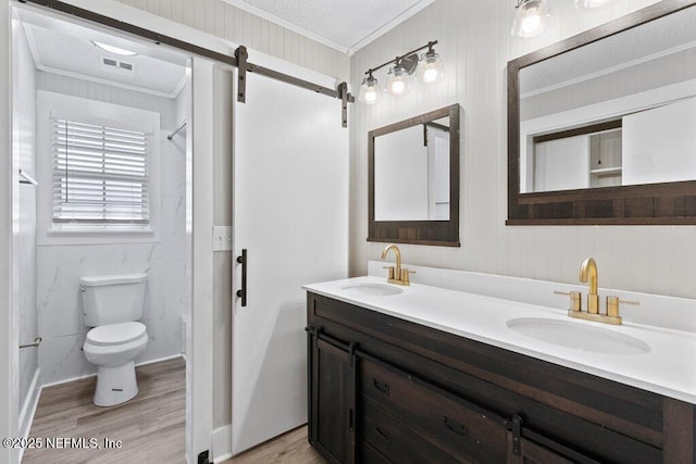 1967 Sussex Dr S, Orange Park, FL 32073 - full bath featuring visible vents, ornamental molding, a sink, and wood finished floors