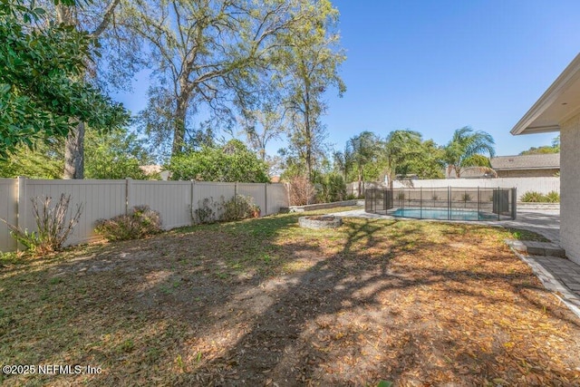 1967 Sussex Dr S, Orange Park, FL 32073 - view of yard with a fenced in pool and a fenced backyard