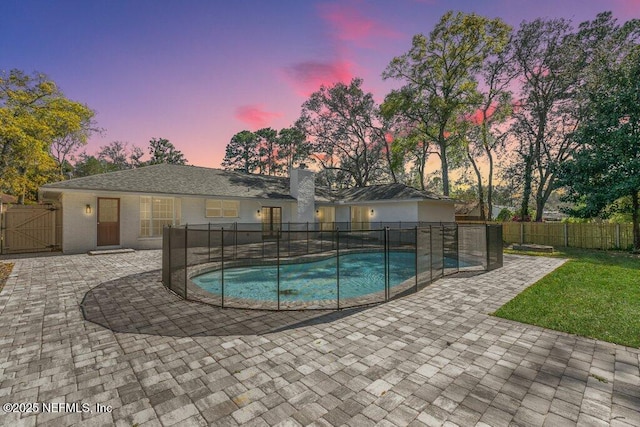 1967 Sussex Dr S, Orange Park, FL 32073 - view of pool featuring a fenced in pool, a gate, fence, and a patio
