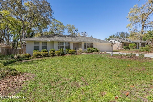 1967 Sussex Dr S, Orange Park, FL 32073 - ranch-style home with a front yard, driveway, fence, and an attached garage
