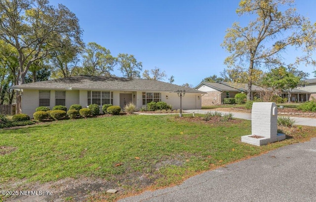 1967 Sussex Dr S, Orange Park, FL 32073 - ranch-style house with driveway, a front yard, and a garage