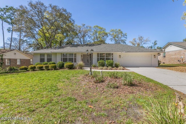 1967 Sussex Dr S, Orange Park, FL 32073 - ranch-style house with driveway, an attached garage, and a front yard