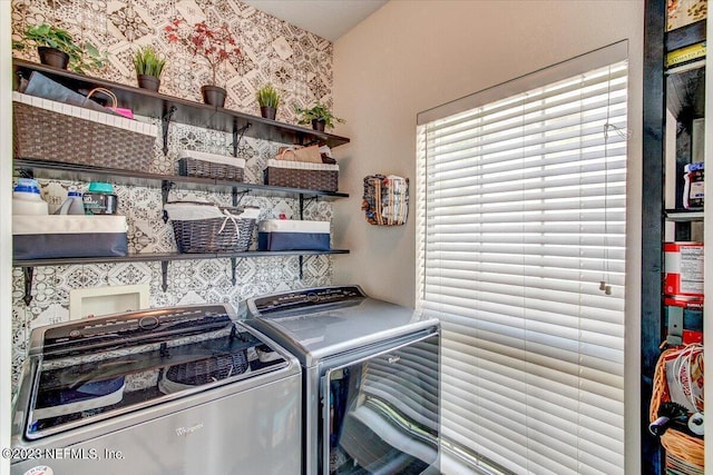 10961 Burnt Mill Rd Unit 1428, Jacksonville, FL 32256 - laundry area featuring independent washer and dryer, wallpapered walls, and laundry area
