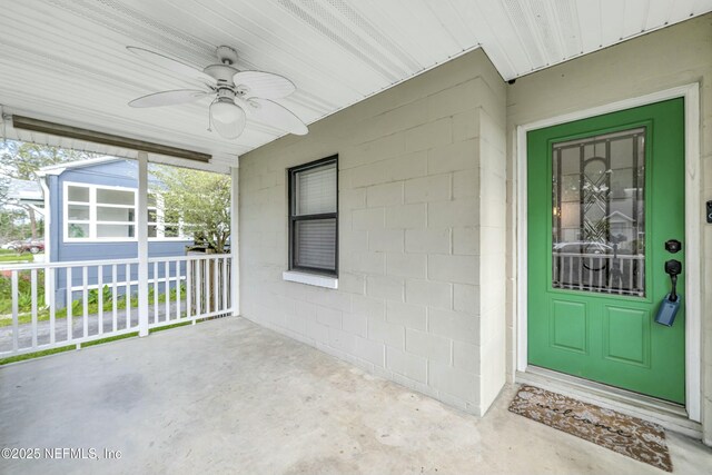 4817 Kerle St, Jacksonville, FL 32205 - entrance to property featuring concrete block siding, ceiling fan, and covered porch