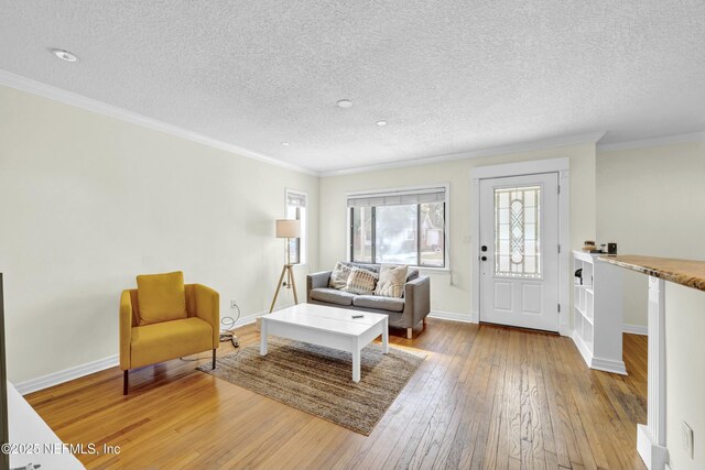 4817 Kerle St, Jacksonville, FL 32205 - living area featuring hardwood / wood-style flooring, baseboards, a textured ceiling, and crown molding
