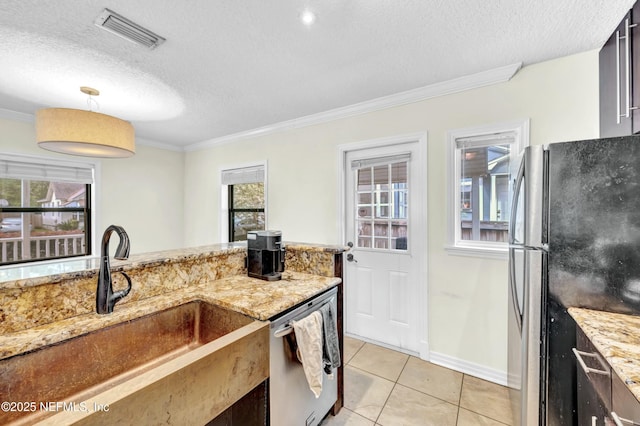 4817 Kerle St, Jacksonville, FL 32205 - kitchen with visible vents, ornamental molding, appliances with stainless steel finishes, and light tile patterned floors