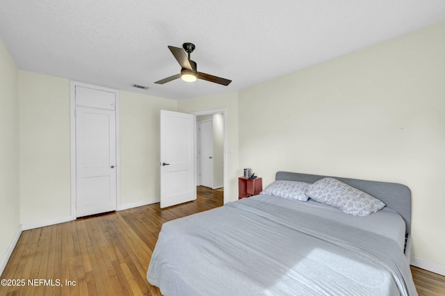 4817 Kerle St, Jacksonville, FL 32205 - bedroom with hardwood / wood-style flooring, a ceiling fan, a textured ceiling, baseboards, and visible vents