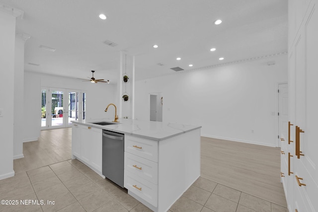 kitchen featuring a sink, a ceiling fan, stainless steel dishwasher, open floor plan, and light tile patterned floors