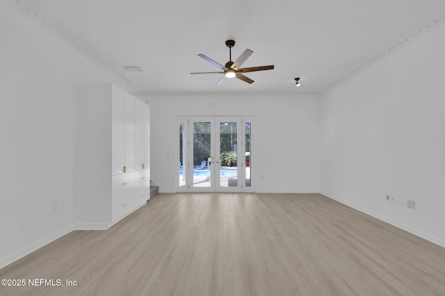 unfurnished room with french doors, a ceiling fan, baseboards, and light wood-style floors