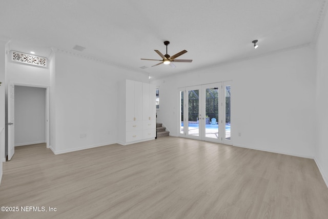 interior space featuring french doors, baseboards, light wood finished floors, and ceiling fan