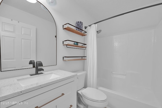 bathroom featuring shower / bath combo, toilet, and vanity