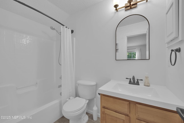 full bathroom featuring shower / bath combo, a textured ceiling, toilet, and vanity