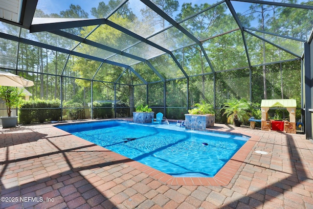 outdoor pool with a lanai and a patio