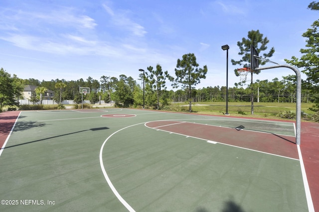 view of sport court featuring community basketball court and fence