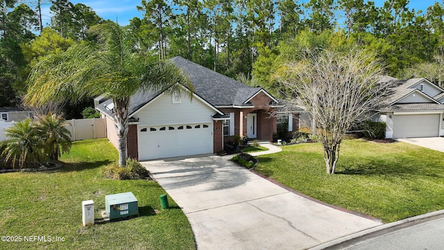 view of front of property featuring fence, a garage, a front yard, brick siding, and driveway