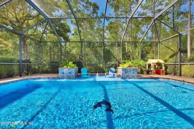 pool with a patio and glass enclosure