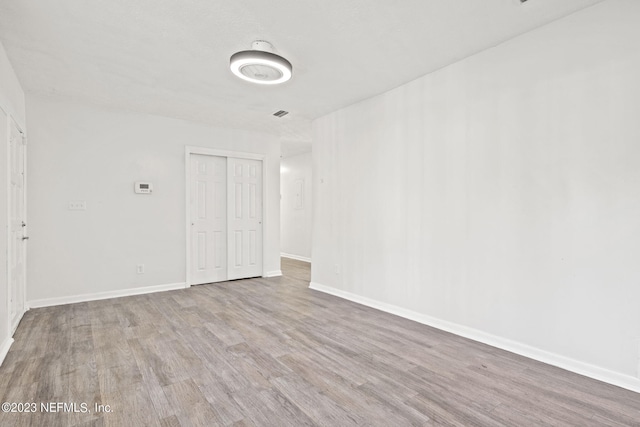 3838 Winton Dr, Jacksonville, FL 32208 - empty room with baseboards and wood finished floors