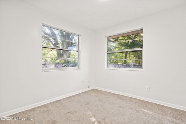 3838 Winton Dr, Jacksonville, FL 32208 - carpeted spare room featuring baseboards