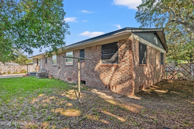 3838 Winton Dr, Jacksonville, FL 32208 - view of property exterior featuring crawl space, fence, and brick siding