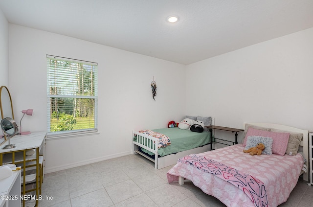 tiled bedroom with baseboards
