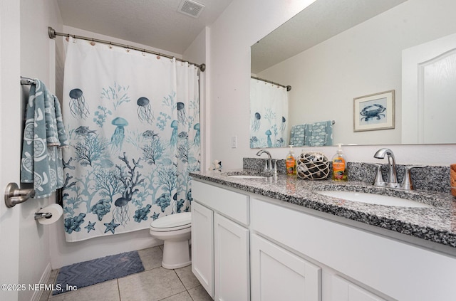 bathroom with toilet, tile patterned floors, visible vents, and a sink