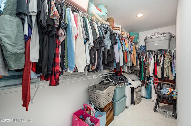 spacious closet with tile patterned flooring