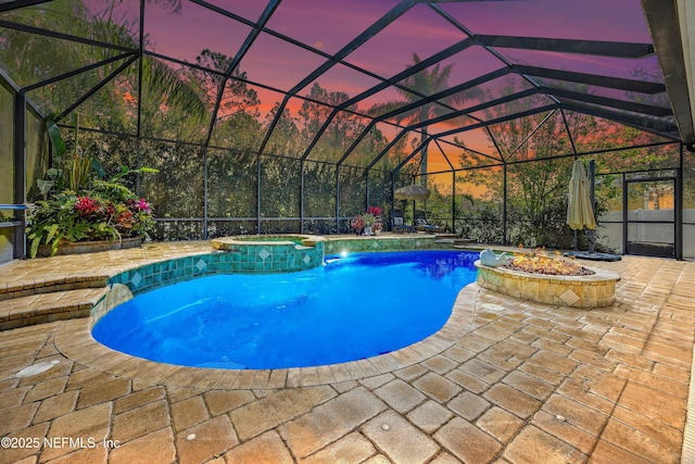 110 Arabian Ct, Saint Augustine, FL 32095 - view of pool featuring a pool with connected hot tub, a fire pit, glass enclosure, and a patio