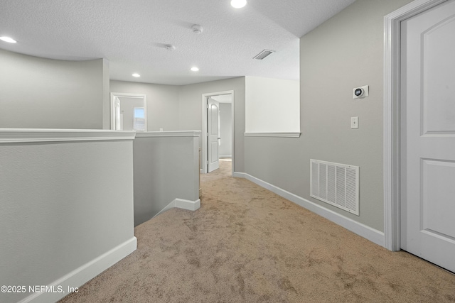 110 Arabian Ct, Saint Augustine, FL 32095 - hallway featuring baseboards, visible vents, an upstairs landing, and carpet flooring