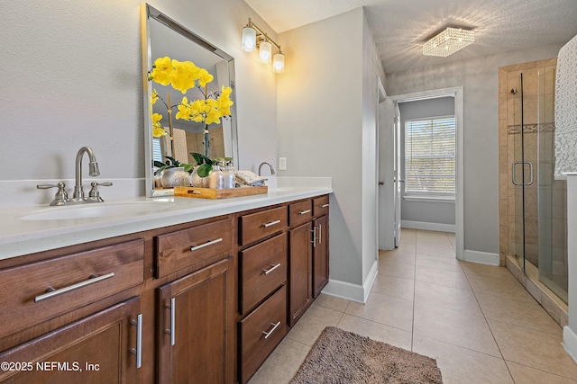 110 Arabian Ct, Saint Augustine, FL 32095 - full bathroom featuring a shower stall, baseboards, double vanity, a sink, and tile patterned flooring