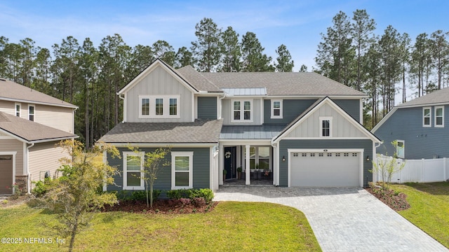 64 Whirlaway Ct, Saint Johns, FL 32259 - view of front of house with board and batten siding, decorative driveway, and a shingled roof