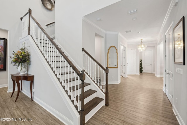 64 Whirlaway Ct, Saint Johns, FL 32259 - entrance foyer featuring a chandelier, stairway, ornamental molding, wood finished floors, and baseboards
