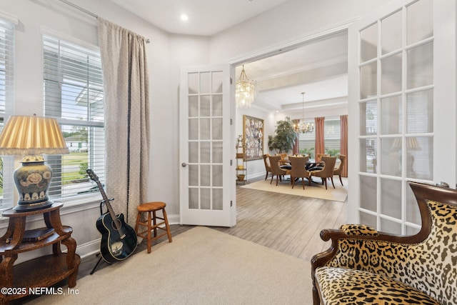 64 Whirlaway Ct, Saint Johns, FL 32259 - living area with a chandelier, wood finished floors, french doors, and baseboards